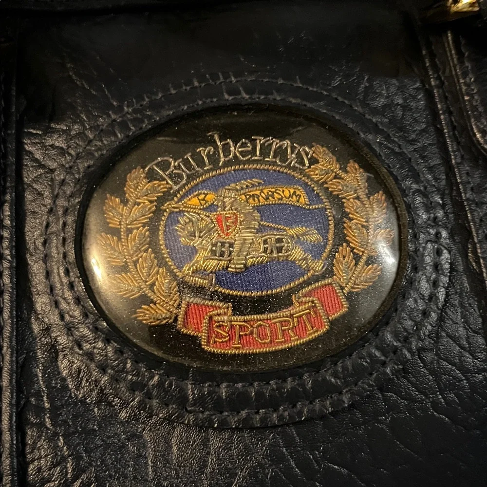 Burberrys Dark Navy Leather Bag with Embroidered Patch